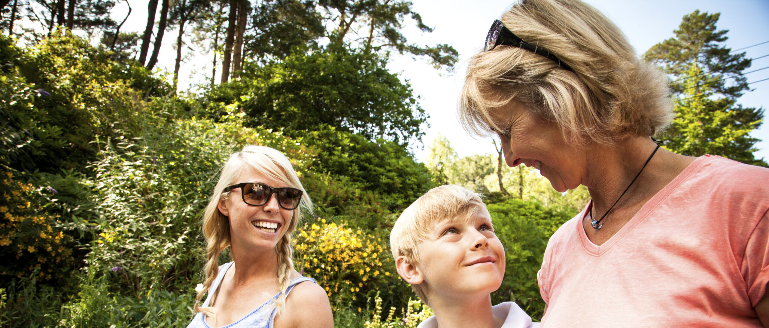 Family enjoying a sunny day in the garden